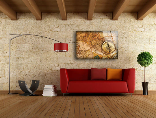 Stone wall background with exposed wooden beams above a red couch showcasing best glass art.