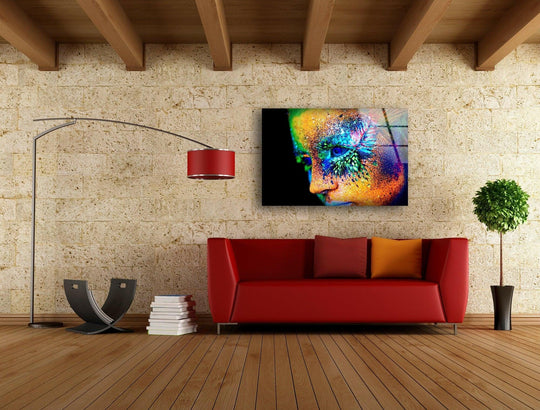 The art from glass features a stark black background, emphasizing the vibrant, colorful woman's face with ample negative space.