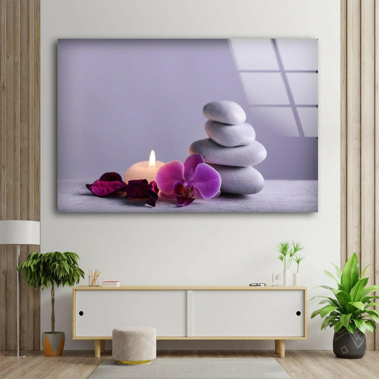 Tranquil spa stones, a vibrant orchid, and a lit candle glow beautifully on this glass printing.