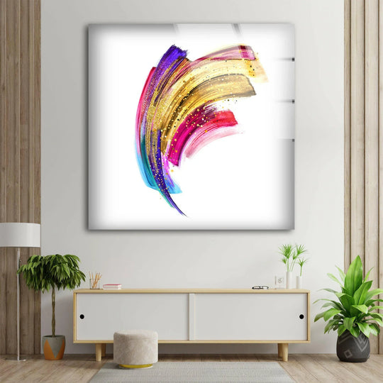 A vibrant abstract glass wall art decor with golden and colorful brushstrokes creating a dynamic, luxurious visual flow.