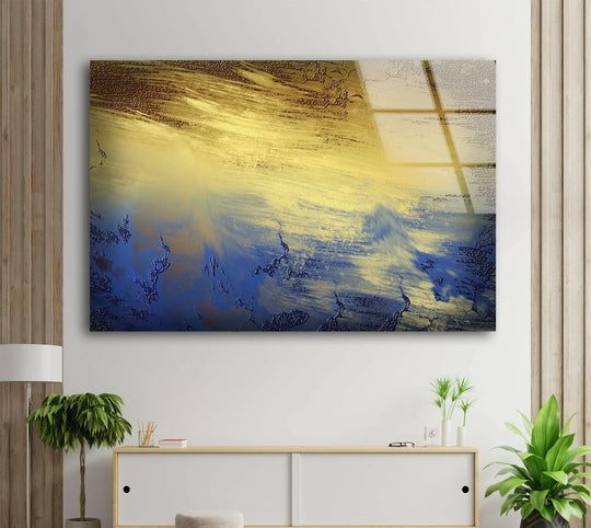 Bronze blue abstract glass wall art showcasing a dramatic layering effect of textures and colors, like swirling water and cracked earth.