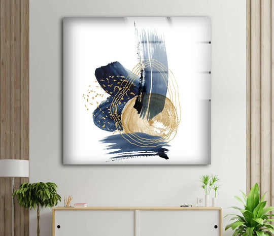 Gleaming glass wall art captures abstract strokes with luminous gold accents, creating subtle interplay of light and shadow in this striking home decor piece.