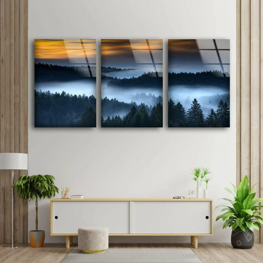 Foggy forest glass wall art shows a forest landscape at sunset and is nature inspired decor creating a peaceful atmosphere with misty forest scenery