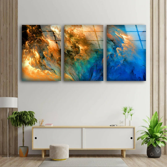 The abstract glass wall art shows a cloudy motif in yellow and blue shades and is vibrant decor for three pieces wall art and abstract wall art