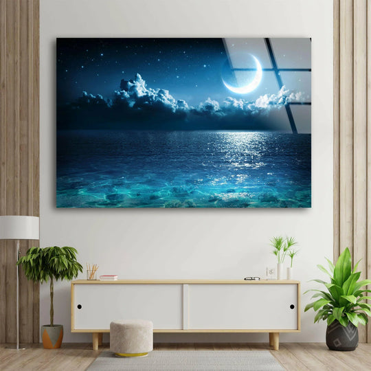Featuring a dreamy night sky with stars as home decor in this Night Sky with Stars Glass Wall Art, complemented by soft clouds and a crescent moon.