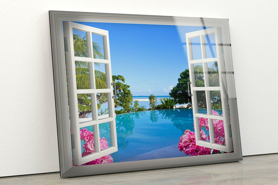 Vibrant tropical scenery with blue waters and pink flowers, framed by an open window.
