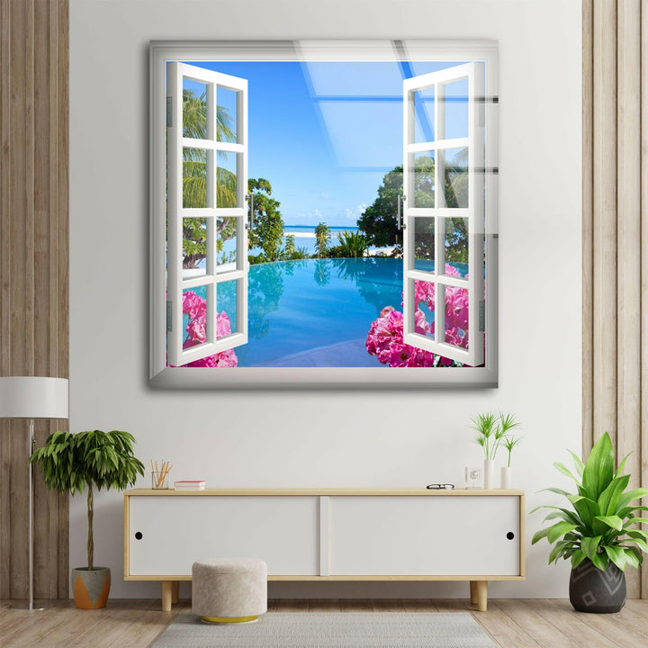 High-definition glass wall art featuring a tropical resort scene with palm trees and an infinity pool.
