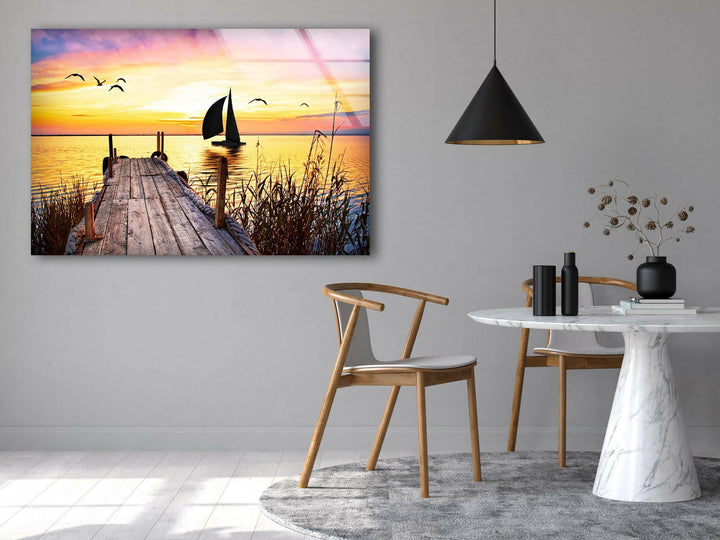 Golden Sunset Over the Ocean with a Pier – A Captivating Glass Print
