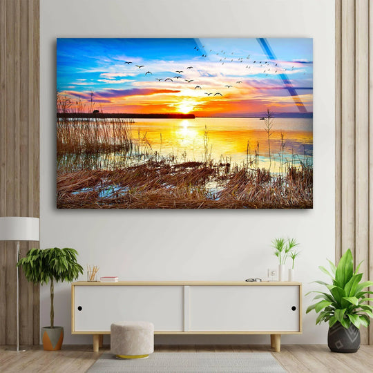 Landscape glass wall art golden sunset reflecting on lake waters and serene nature scene print for modern decor