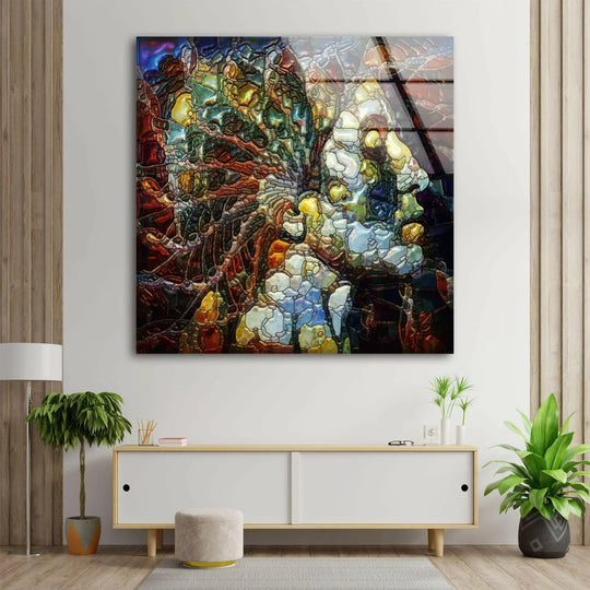 Glass wall art with deep indigo shadows framing the stained face mosaic art.