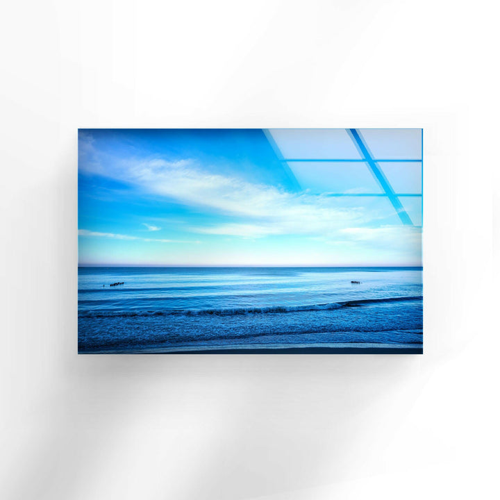 A peaceful ocean scene with soft waves touching the horizon.