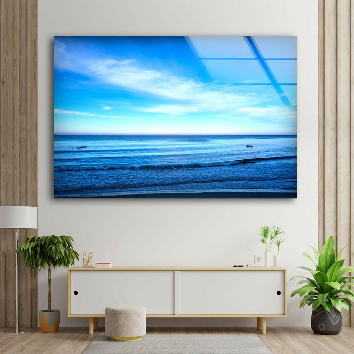 A stunning seascape featuring calm ocean waves under a bright sky.

