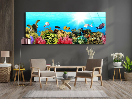 Marine Fishes glass wall art showcases vibrant coral and tropical fish and features a sea turtle and sunbeams in panoramic style for modern wall decor and adds a scenic touch to a living room