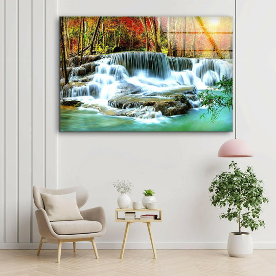 Waterfall in Deep Forest glass wall art features a landscape motif and forest scene and makes peaceful landscape decor with its vibrant colors on a white wall