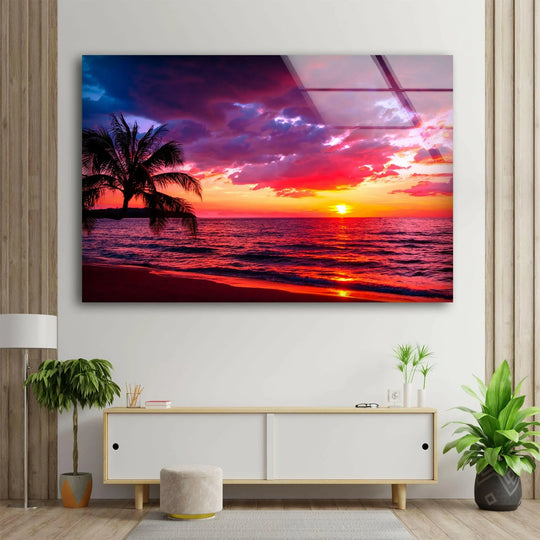 Landscape glass wall art sunset red tropical evening and landscape decor plus ocean colors with bright light and palm tree.