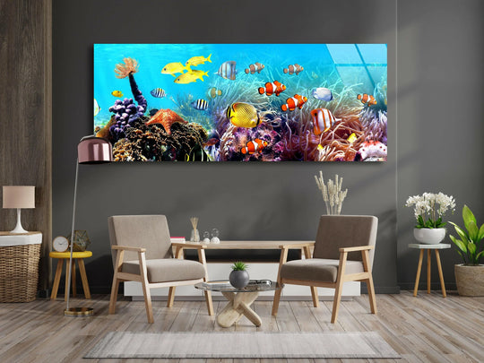 Undersea Tropical Fishes glass wall art showcases vibrant coral and colorful fish and offers stunning panoramic ocean inspired decor for a living room