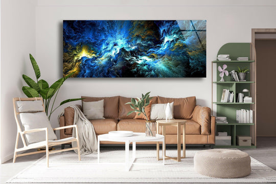 Blue black lightning cloud abstract glass wall art features a dramatic swirling motif and vivid colors above a brown sofa in a living room