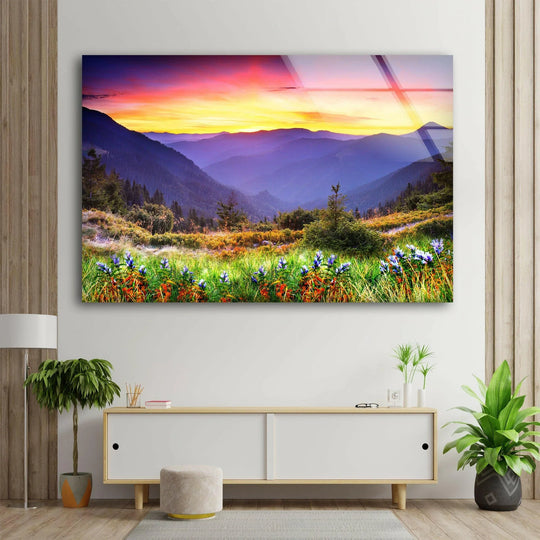 Landscape glass wall art mountain scene with meadow flowers and stunning sunset a nature lover decor piece