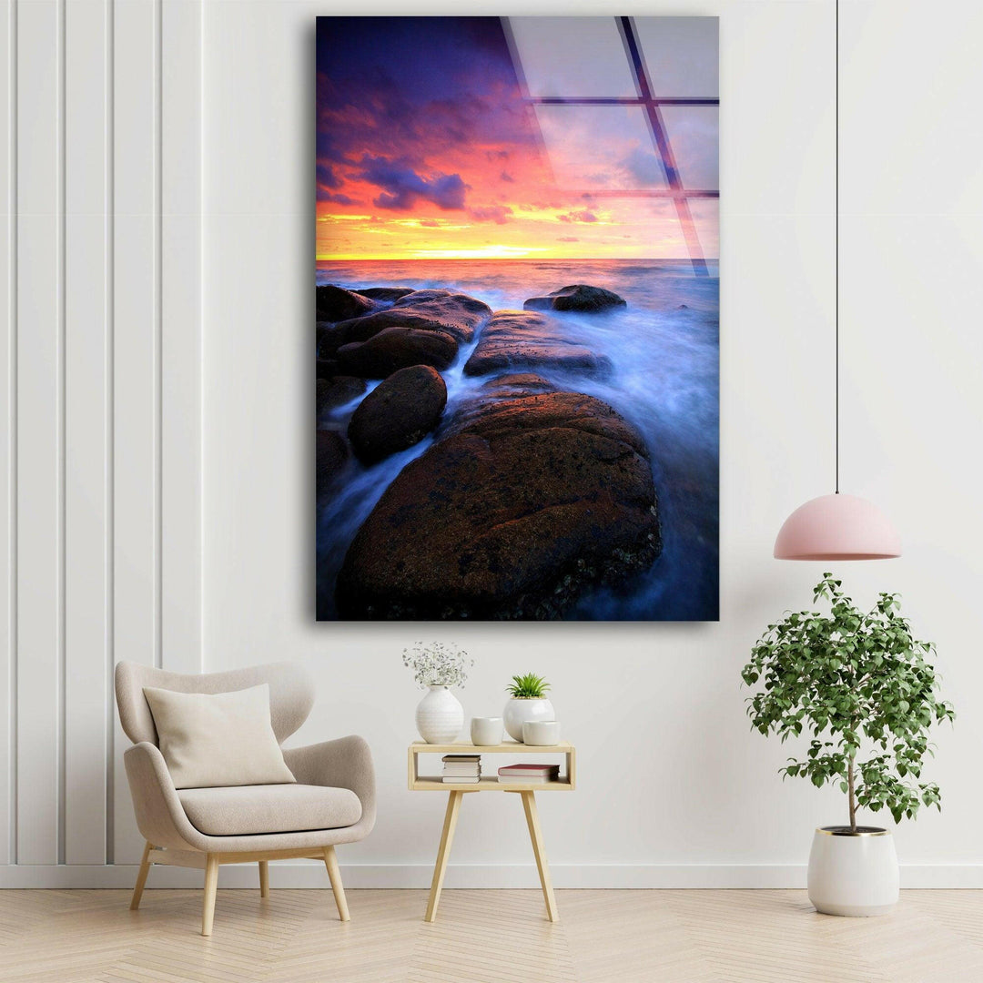 Vibrant seascape featuring a colorful sunset and smooth water motion on tempered glass.

