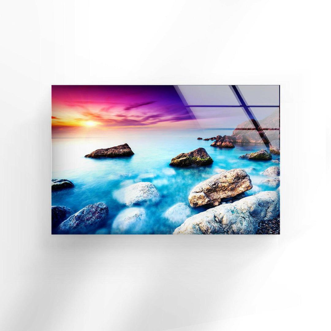 Vibrant Sunset Over the Ocean with Rugged Rocks – A Captivating Glass Artwork

