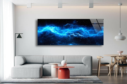 Blue Galaxy and Nebula Star glass wall art displays a vibrant cosmic scene and features a horizontal orientation above a gray sofa in a living room