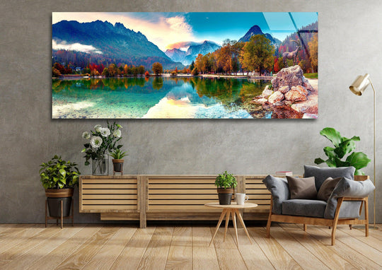 Lake Jasna nature landscape glass wall art showcases stunning mountain reflections and autumn trees and is a panoramic statement wall art piece for modern wall decor above a sofa