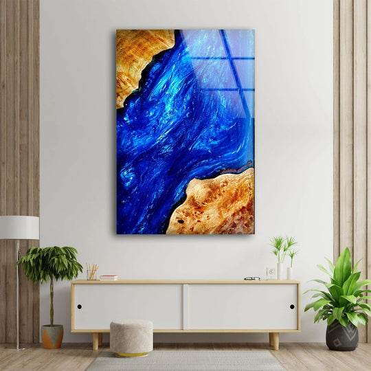 Dominant sapphire blue swirls and golden wood tones create a stunning abstract epoxy best glass art.