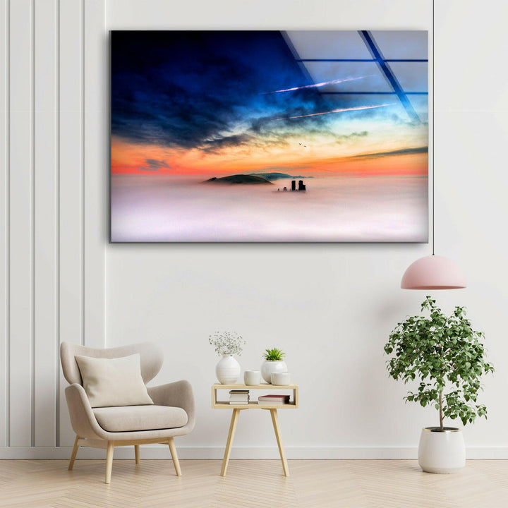 Ethereal misty hills with castle silhouettes and vibrant sky.
