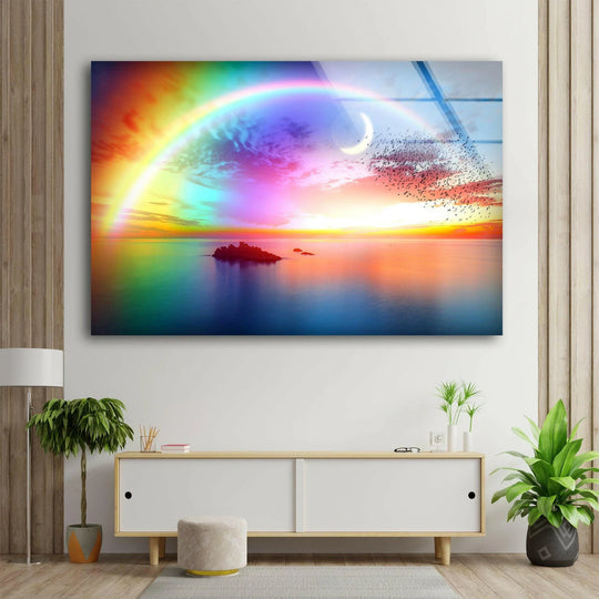 Vibrant color contrast defines the rainbow sunset over tranquil waters in this dreamy sky glass wall art prints, showcasing an island silhouette.