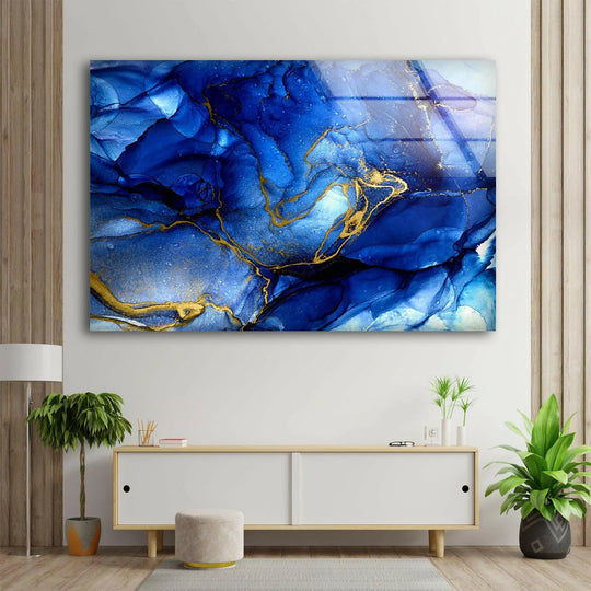 Rich gold veins swirl through vibrant sapphire and azure hues on this striking glass wall art decor.