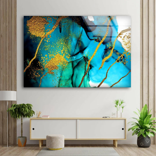 Dappled gold streaks dance across flowing sapphire and emerald abstract glass wall artwork, creating a captivating visual rhythm.