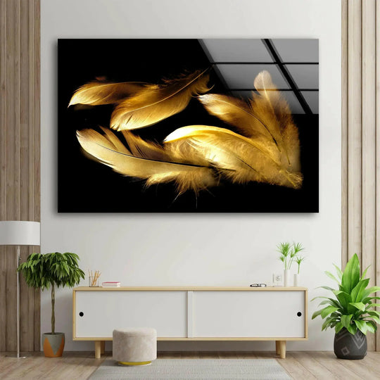 Luminous gold feathers detailed on a striking black background, featured in this stunning glass art.