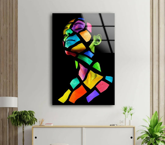 Fragmented human face glass wall art with a striking transition between vibrant colors, perfect for home decoration.