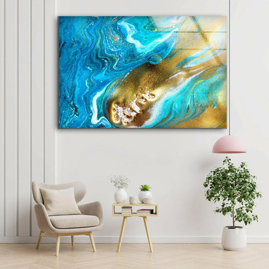 Golden and azure liquid ink swirls dominate this abstract glass wall art, highlighting the brightest area with shimmering brilliance.