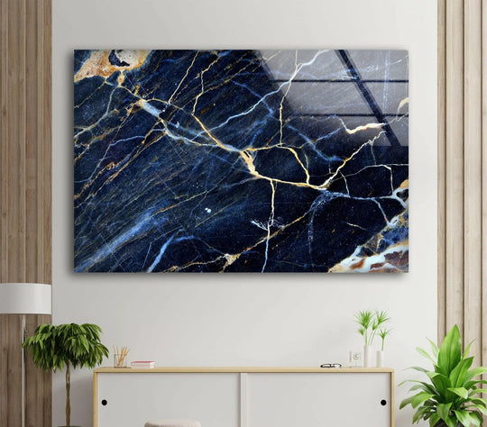 A stunning dark blue marble glass wall art with bold gold veining, perfect for sophisticated home decor.