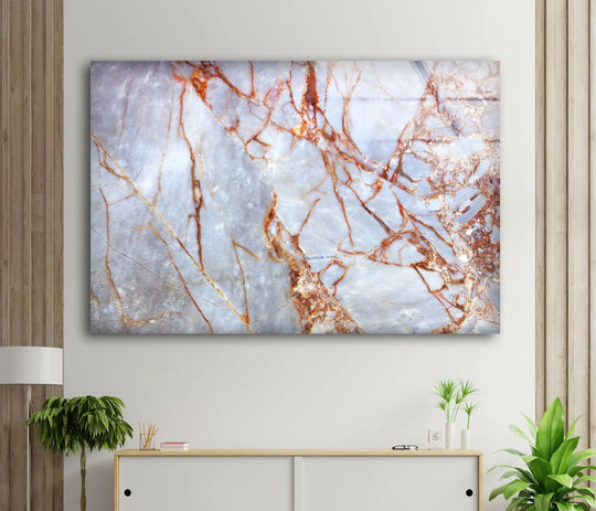 The softest element in this rose gold marble abstract glass wall art is the ethereal, wispy texture of the stone.