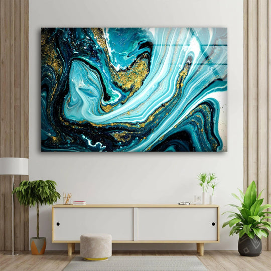 Bold abstract glass wall art with striking gold ink swirls and deep blue marbling.