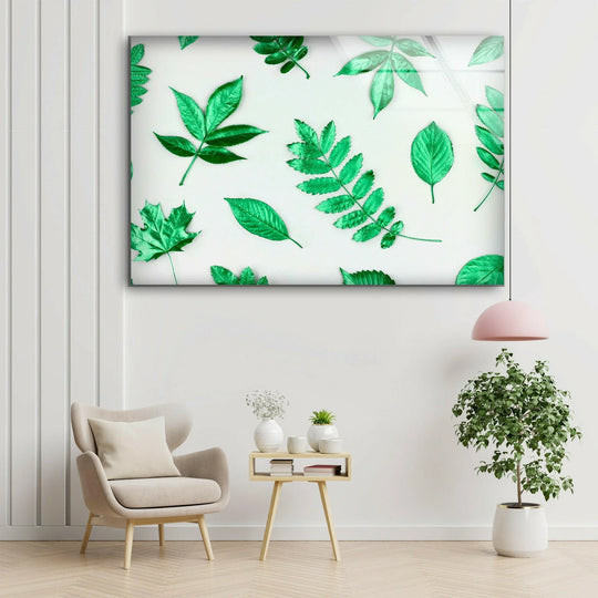 The vivid ruby green leaves take center stage in this attractive glass wall art decor piece, a botanically inspired work printed on reinforced glass.
