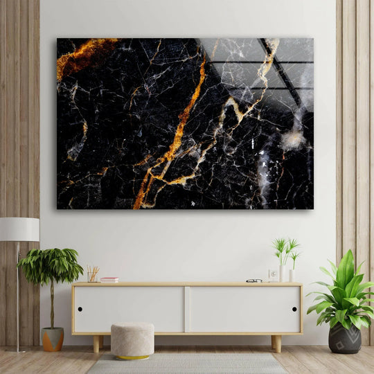 A stunning black and orange marble abstract glass wall art piece adds depth and layers of luxurious color to home decor.