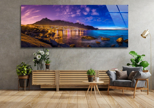 Cape Town Night Landscape glass wall art showcases a scenic city skyline and glowing lights and is a large statement piece for modern wall decor above a sofa