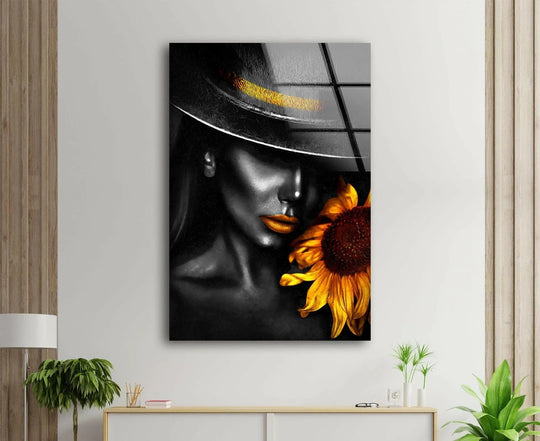 A glamorous woman with golden lips and a black hat is featured on this best glass art with a sunflower.