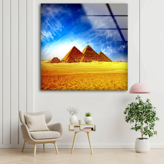 Vast negative space surrounds a vibrant Giza Pyramids print wall art, highlighting the stark contrast between the artwork and the minimalist decor.
