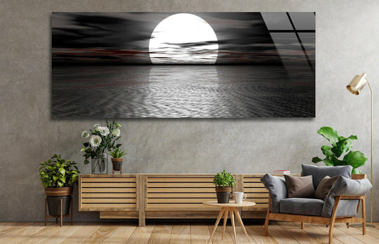 Full Moon Black Seascape glass wall art showcases a bright moon and dark ocean waves and is a stunning panoramic statement wall art piece for modern wall decor above a sofa