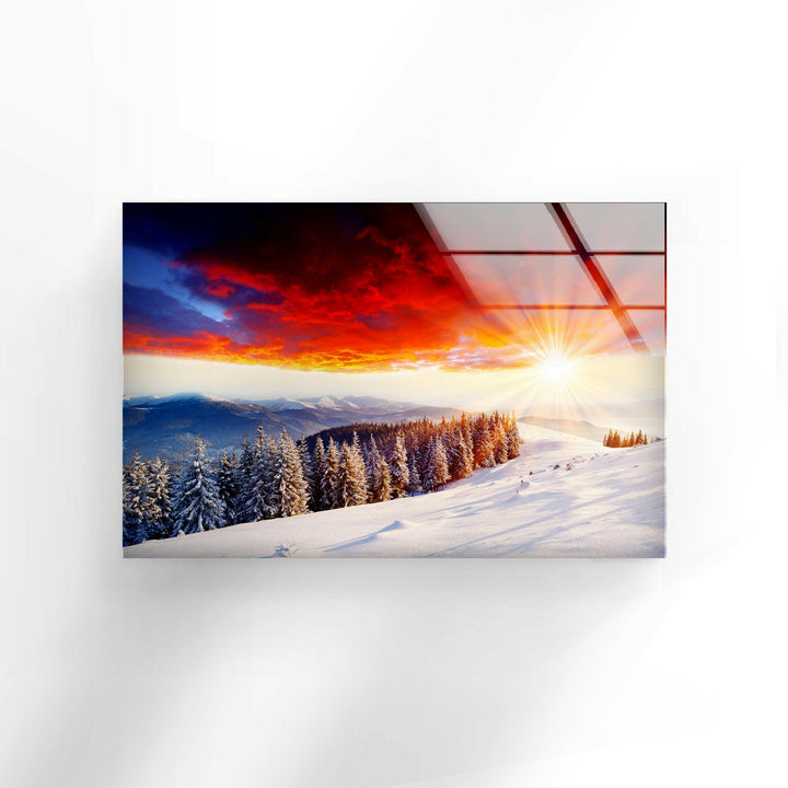 Crisp white snow-covered slopes under a glowing red and orange sky.
