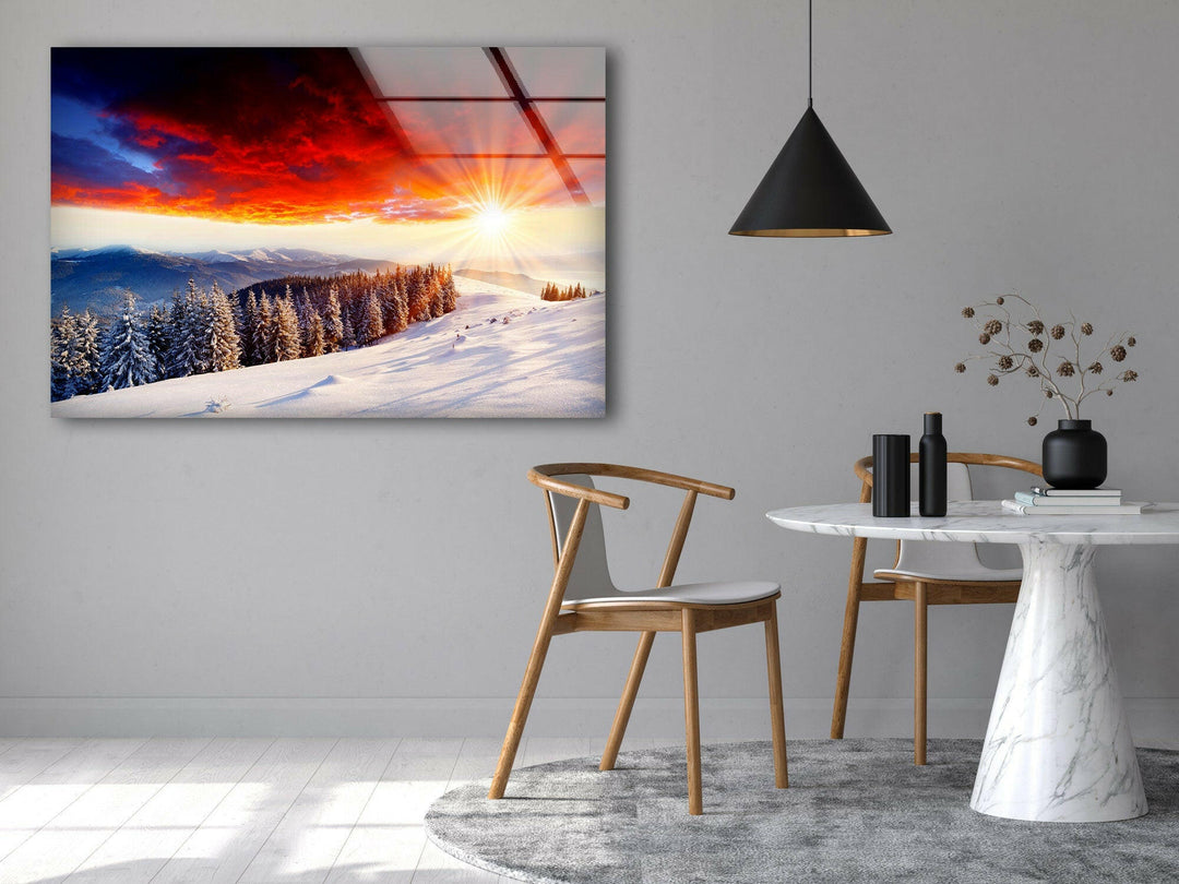Golden sunlight reflecting on a serene, snow-blanketed hillside.
