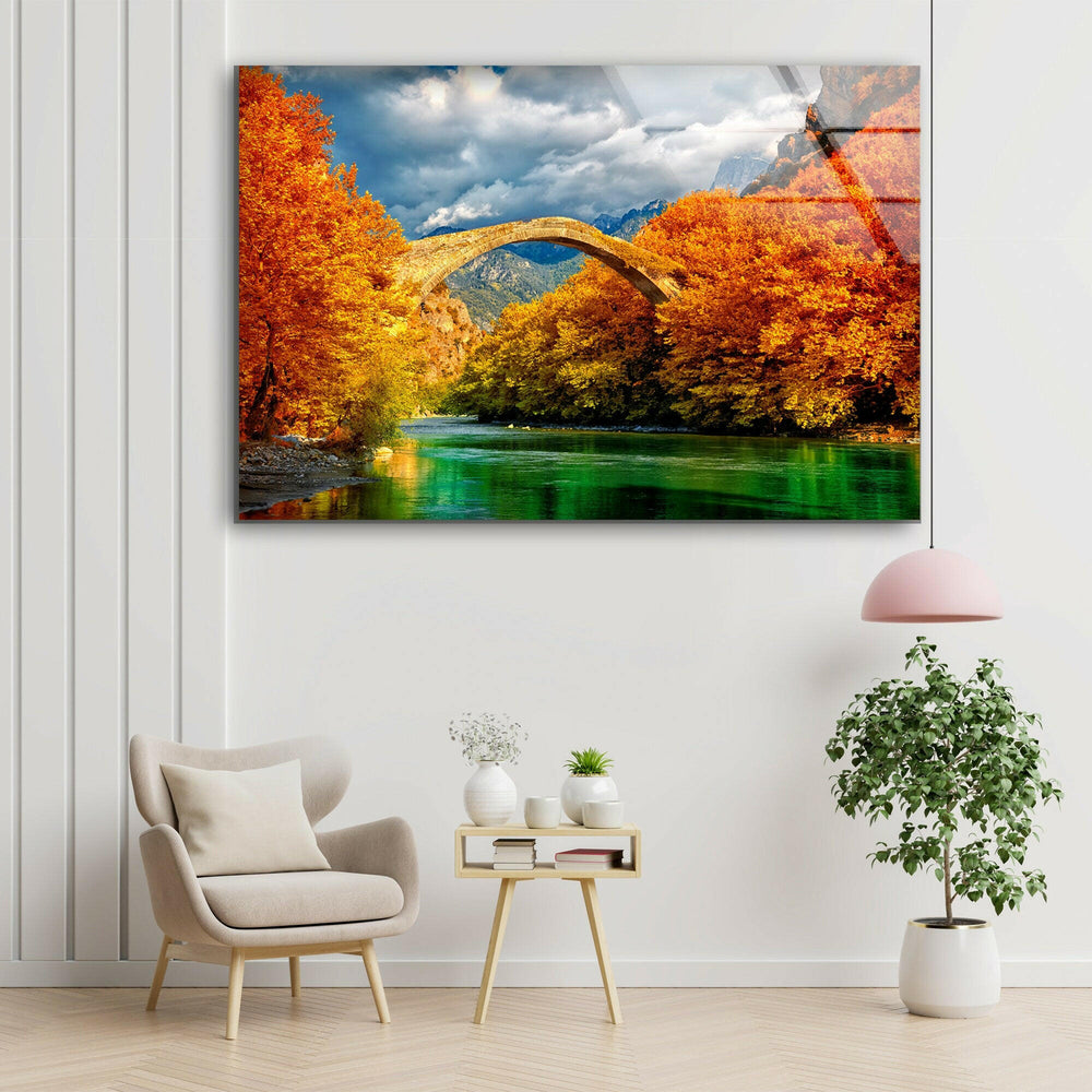 Stunning Stone Bridge Over Emerald River – A Vibrant Autumn Scene
