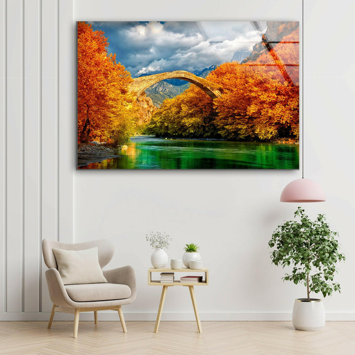 Stunning Stone Bridge Over Emerald River – A Vibrant Autumn Scene
