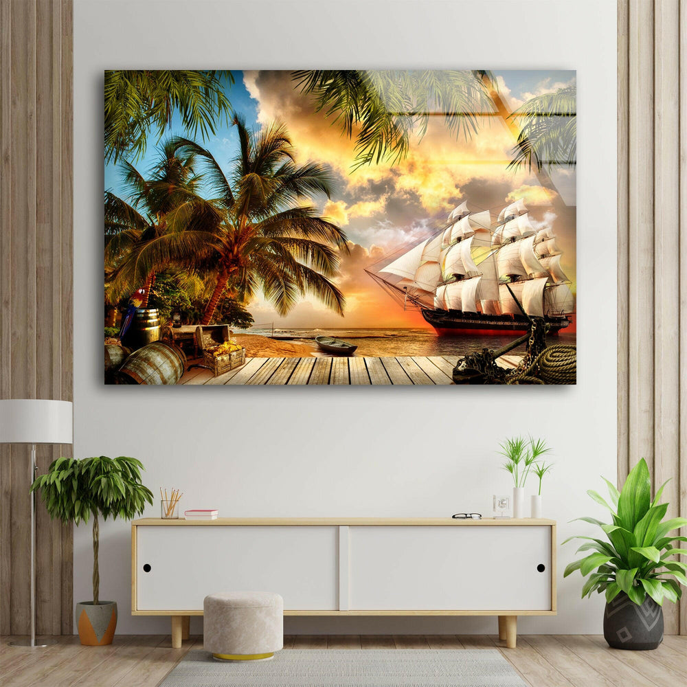A breathtaking glass wall art featuring a pirate ship sailing near a tropical paradise at sunset.
