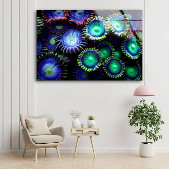 The stillness of the underwater world is captured in this bioluminescent coral bloom glass wall art, showcasing a vivid glow achieved through high-quality glass printing.