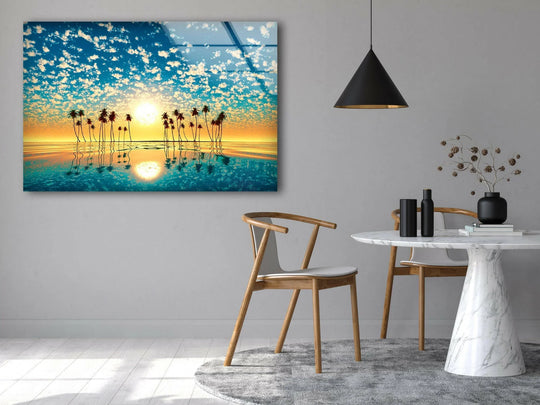 Landscape glass wall art tropical palm tree subject and golden sunset with palm reflections creates a serene ambiance on a wall